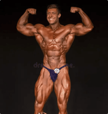 Bodybuilder front double bicep pose with blue posing trunks